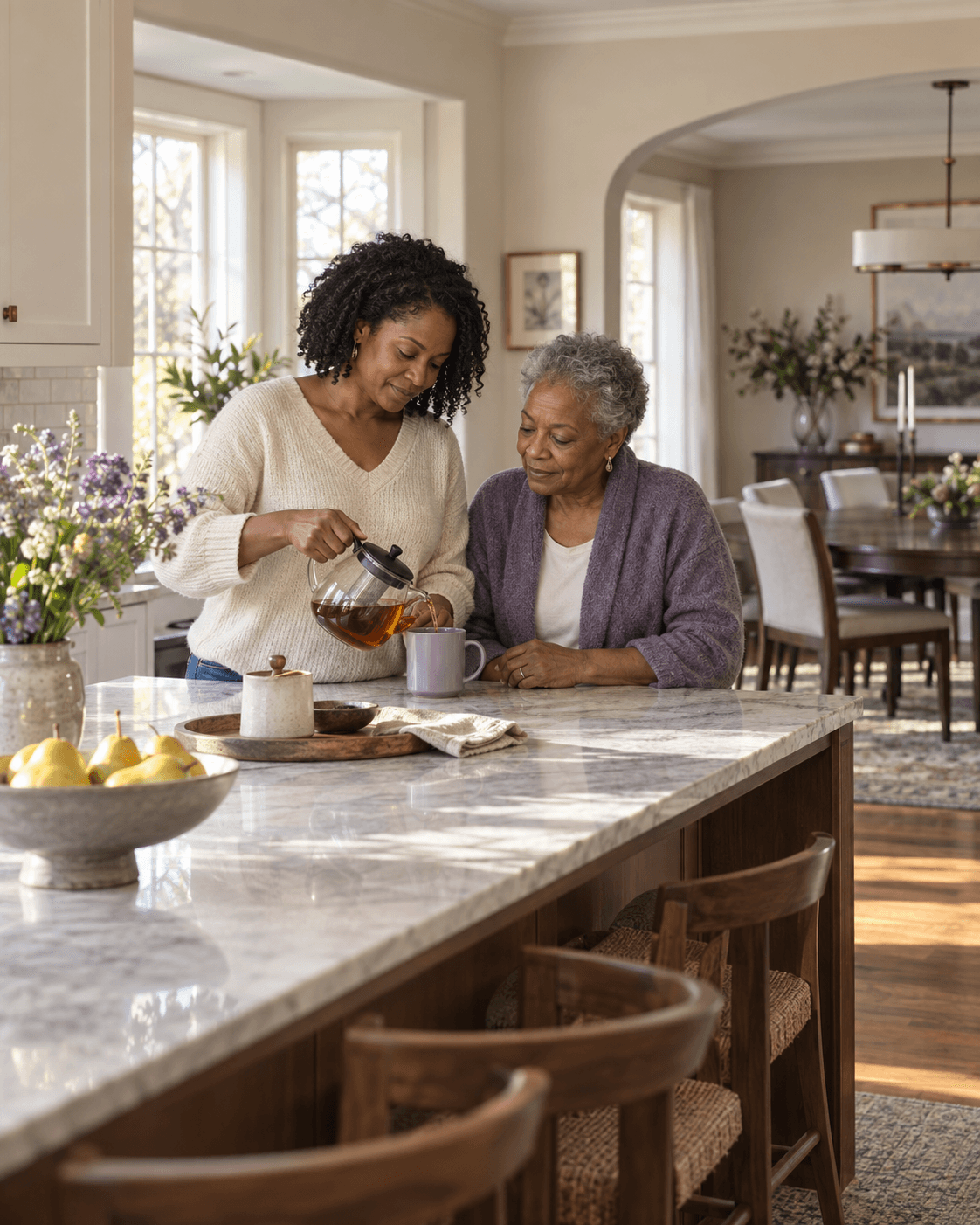 An adult daughter making tea with her mother at home
